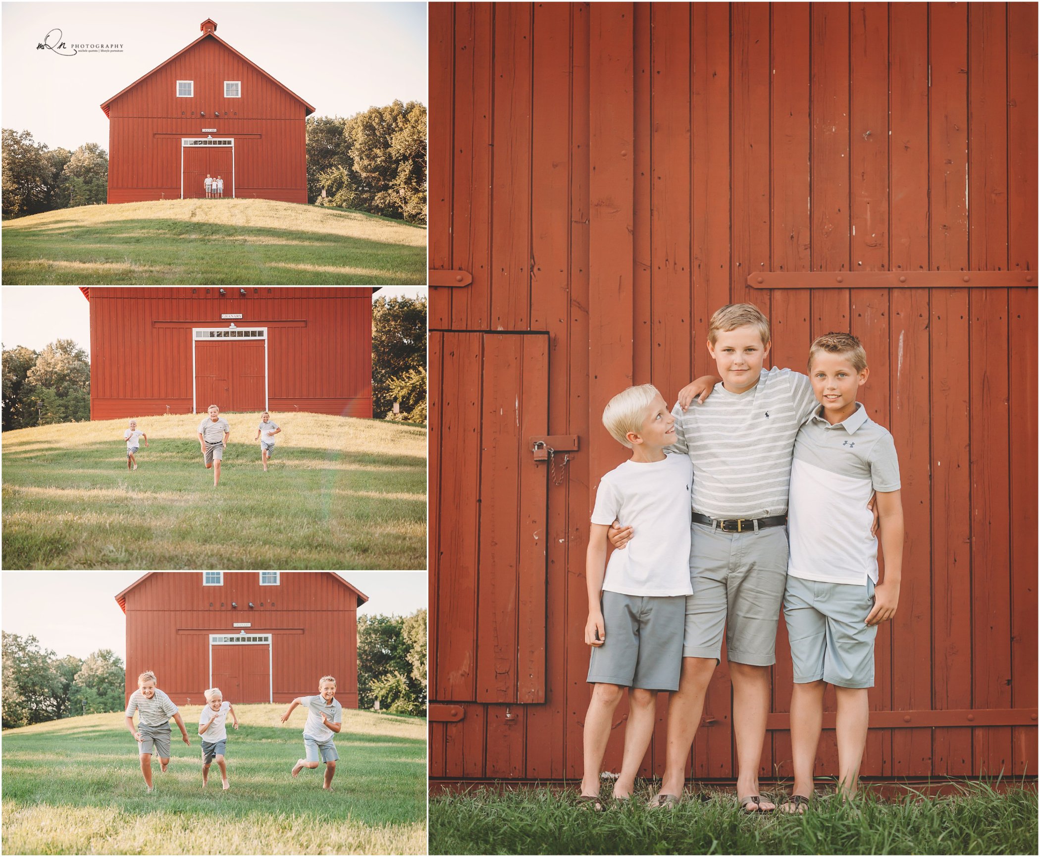 Three children standing together in front of a red barn on a sunny day, with grassy fields surrounding them.