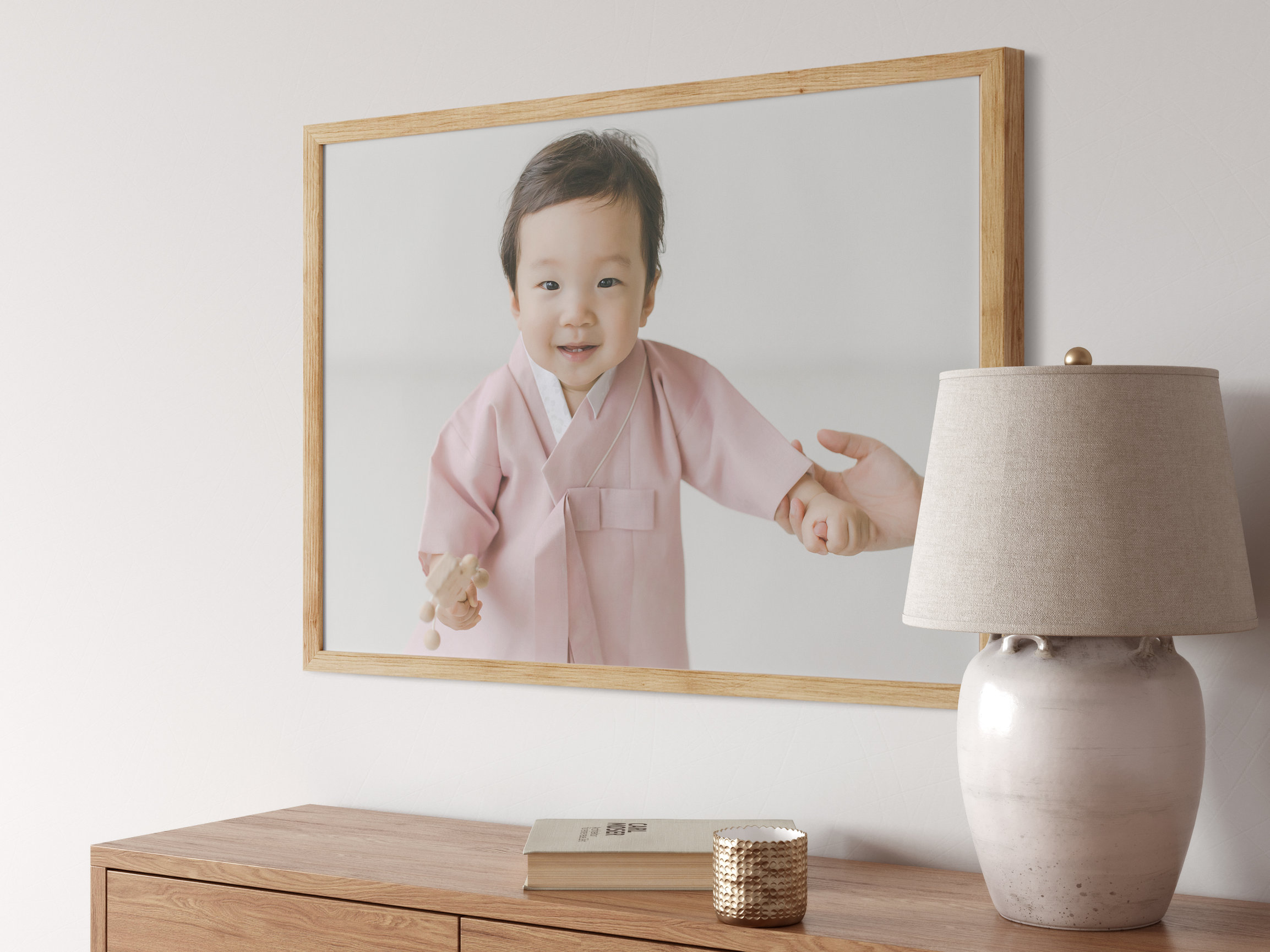 large framed print of toddler boy dressed in traditional cultural attire