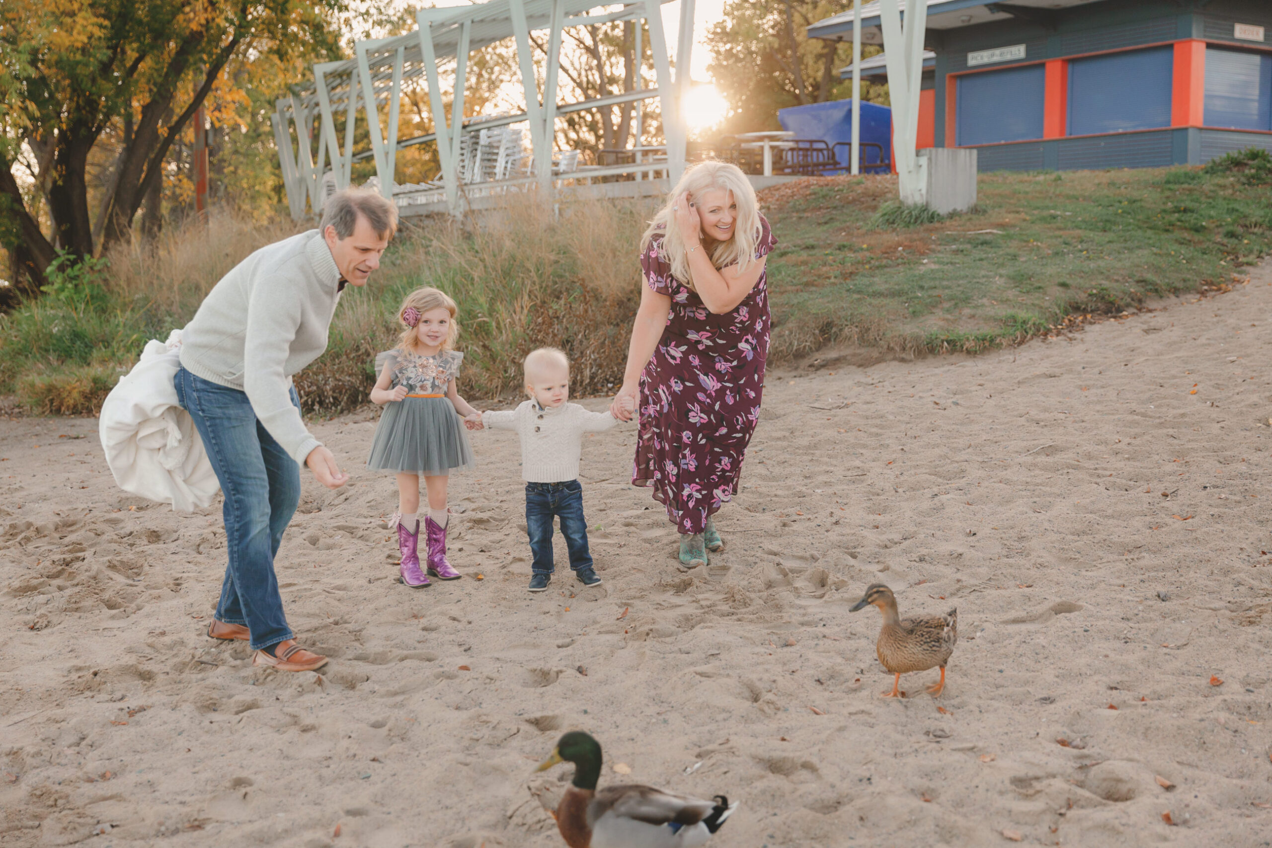 family feeding ducks