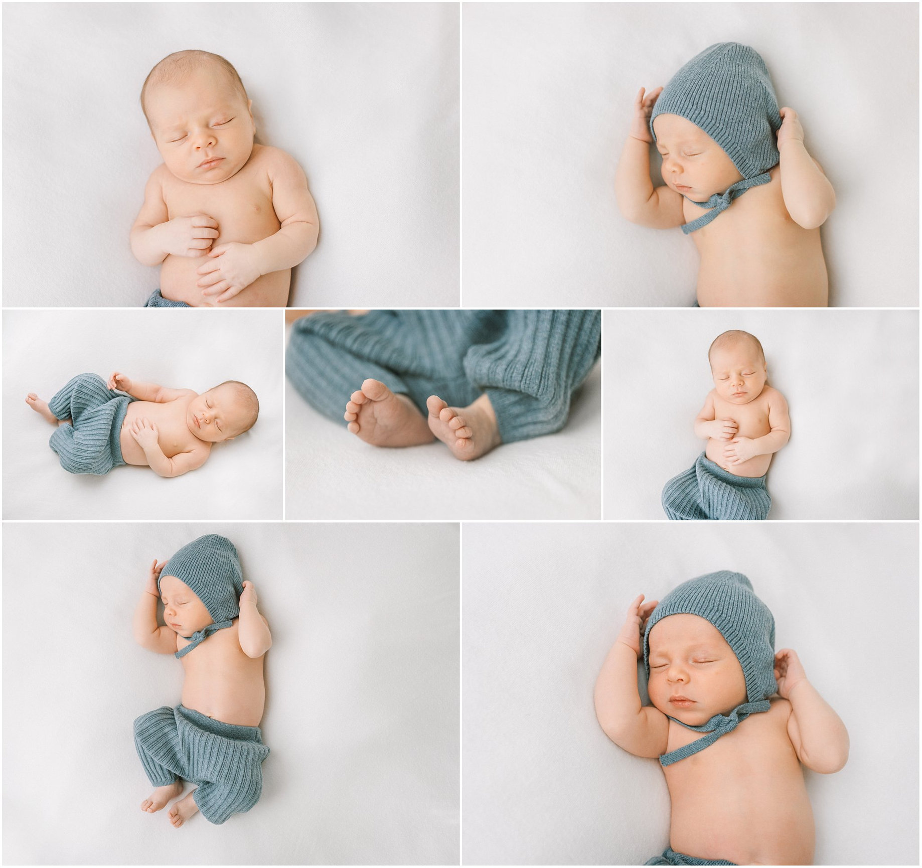 Newborn baby in a blue knitted hat and pants, posed peacefully on a soft white surface.
