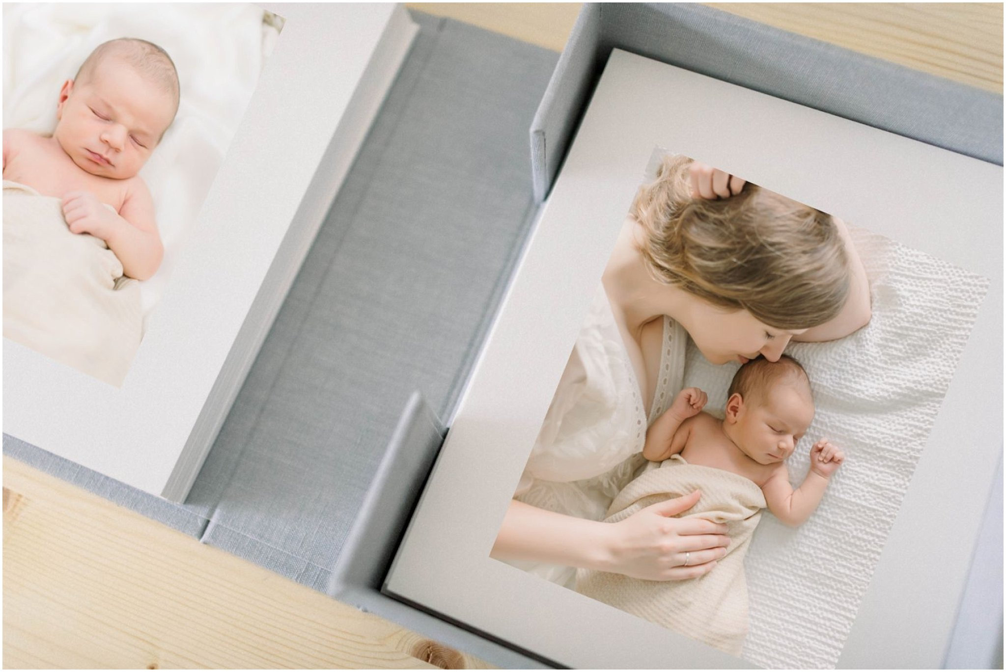 A photo album with images of a sleeping baby and a mother cuddling the baby.