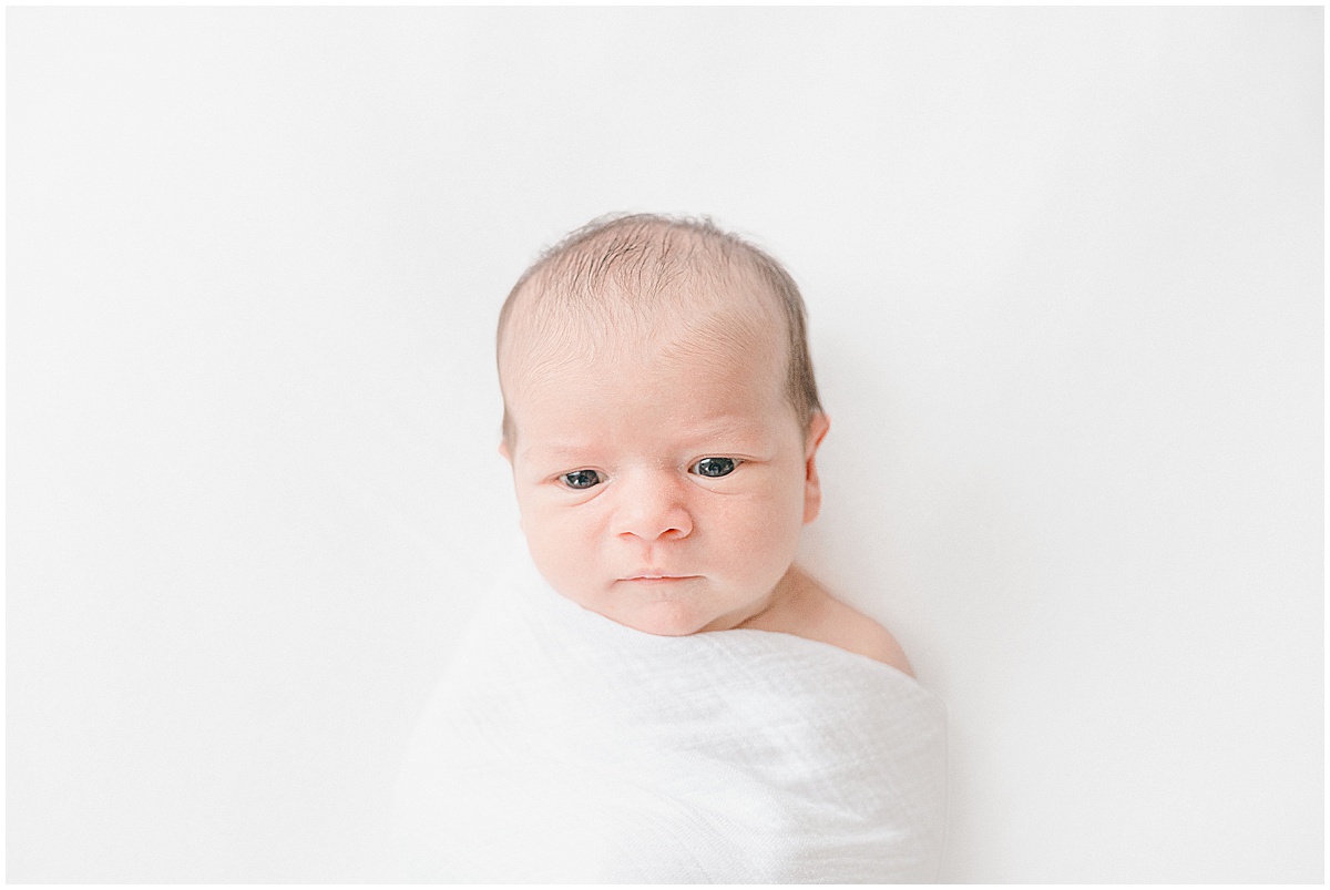 Expecting parents preparing for Baby's 1st Photo Session with a Twin Cities newborn photographer