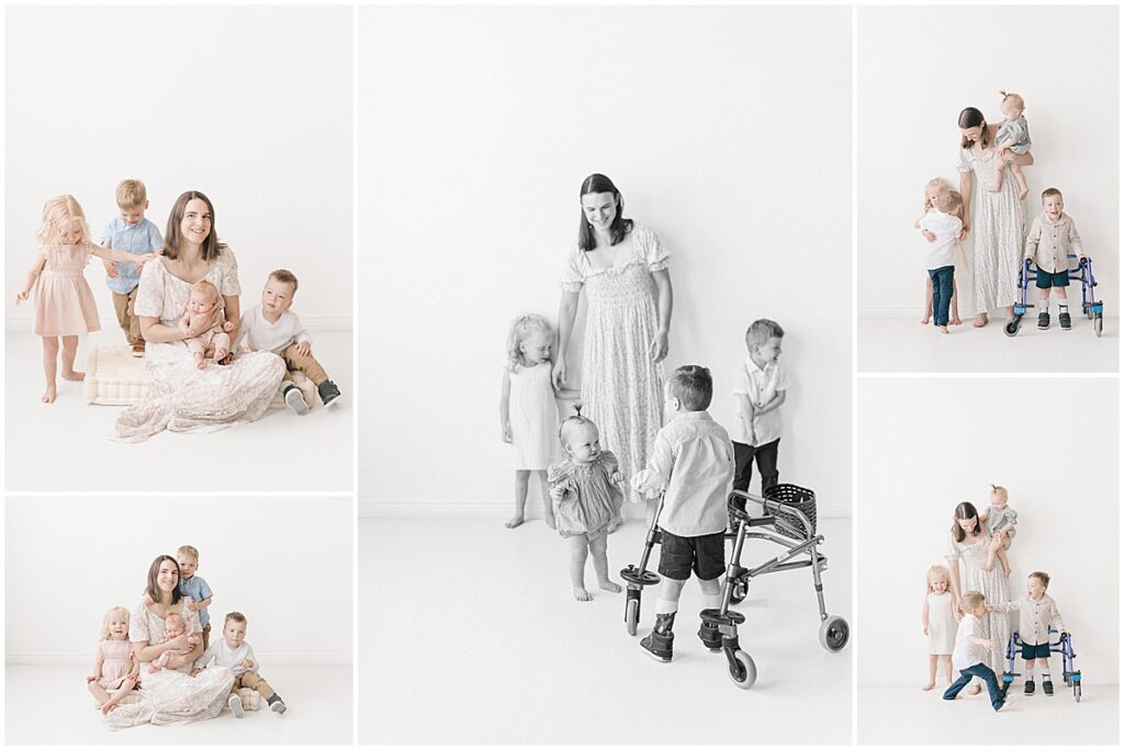 Minneapolis motherhood photographer capturing playful sibling moments during a bright studio motherhood session
