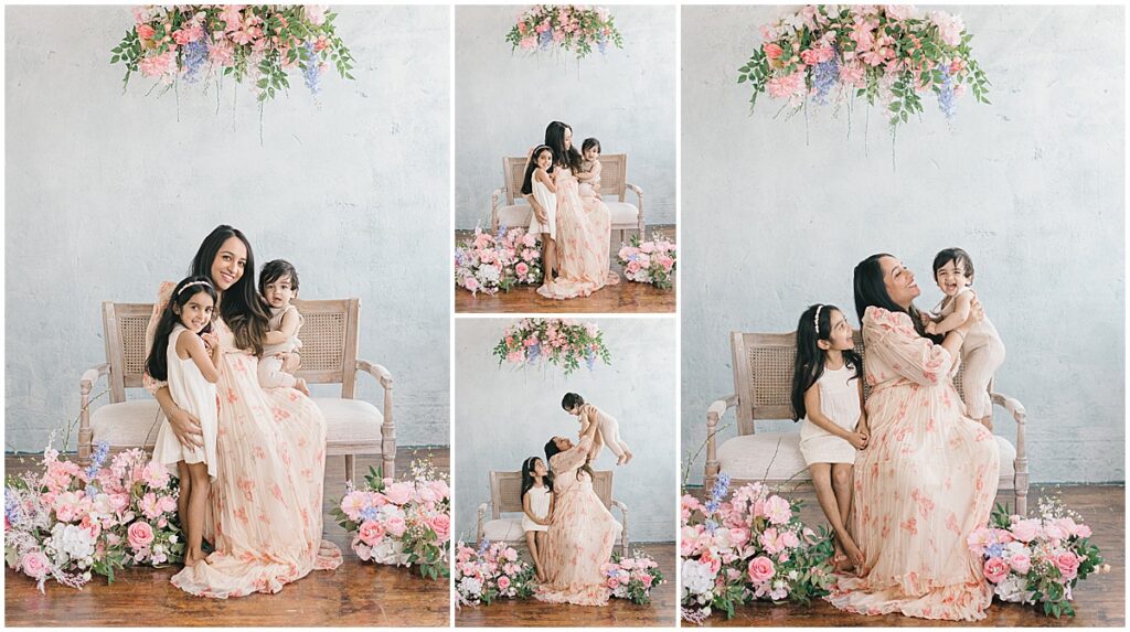 Motherhood Session in Minneapolis with a mom and two children sitting together in a floral studio setup