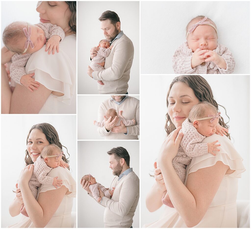 Parents snuggling their newborn baby girl during a soft studio Minneapolis newborn session