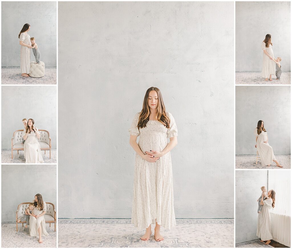 Pregnant mother in a white dress interacting with her young child during a studio maternity session.