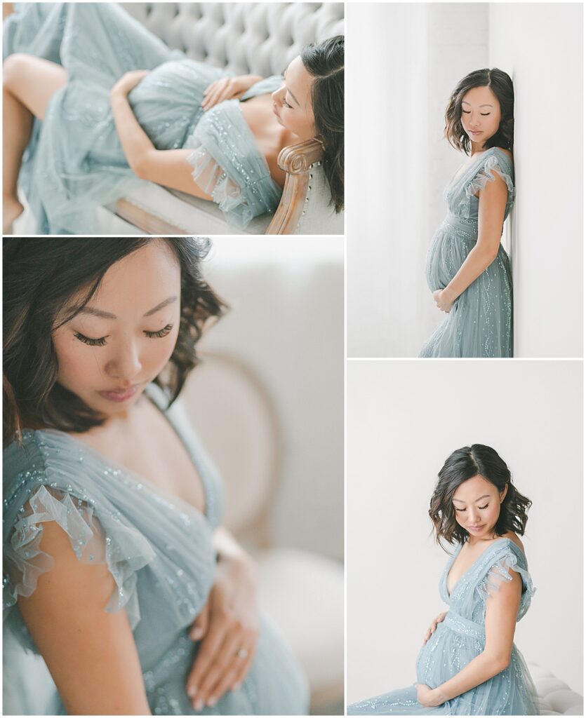 Pregnant woman in a blue embellished gown seated and standing in a bright studio.