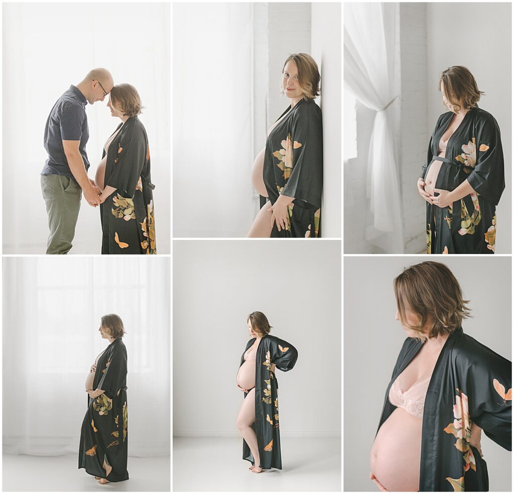 Pregnant woman in a black floral robe and pink lingerie posing alone and with her partner in a light-filled studio.