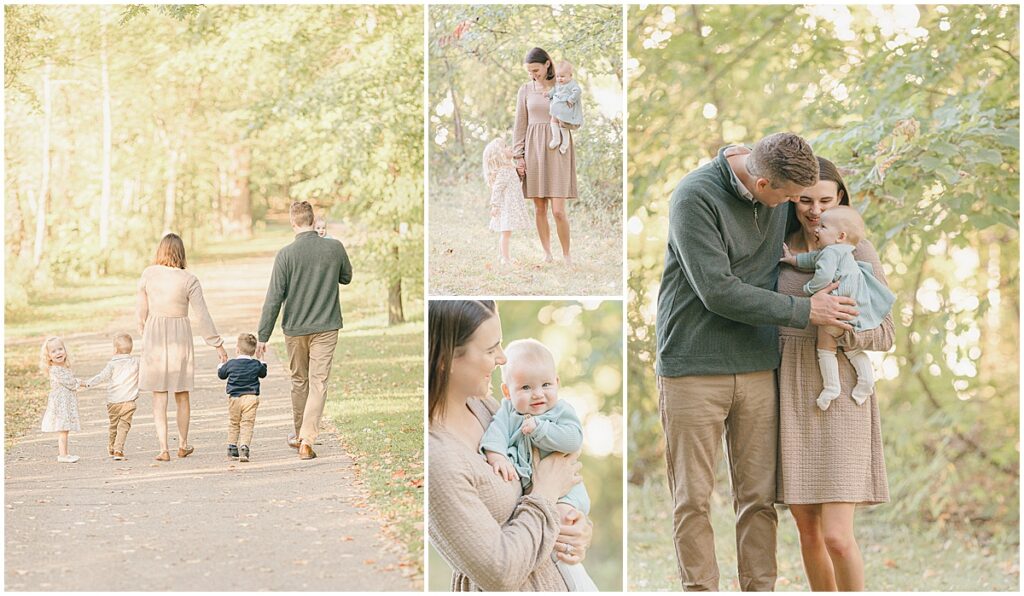Family walking away down a tree-lined path holding hands at Lake Ann Park
